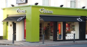 Shop with retractable awning with brand logo