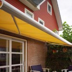 Yellow buttermere awning over patio dining area Yellow buttermere awning over patio dining area