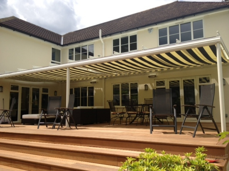 Terrace cover with stripe awning