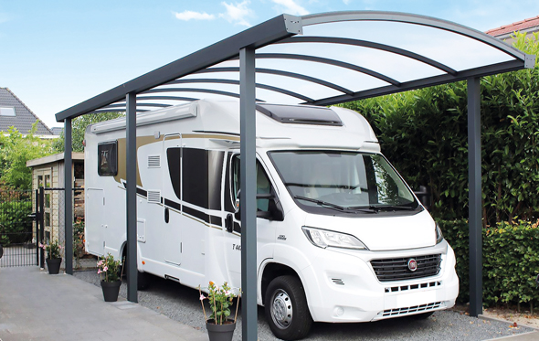 Arched carport with motorhome parked underneath