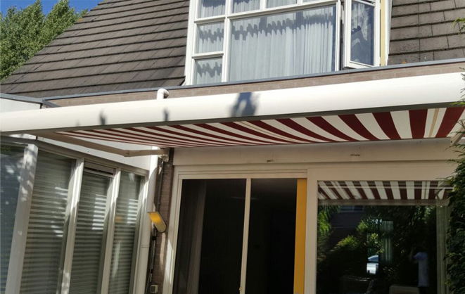 White and red retractable awning