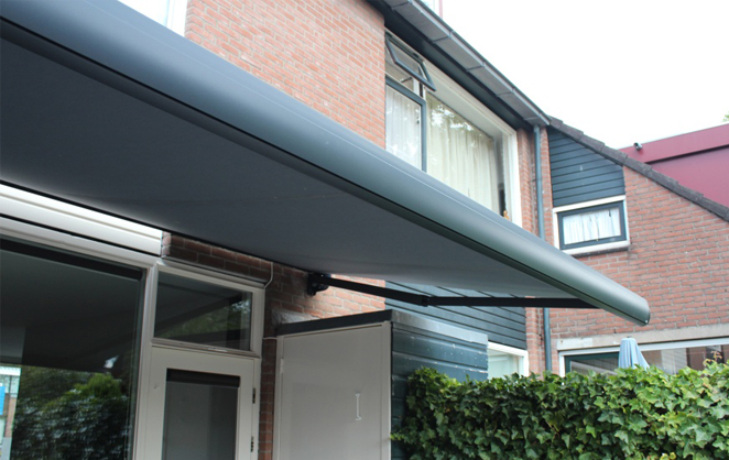 Awning with grey cassette and fabric