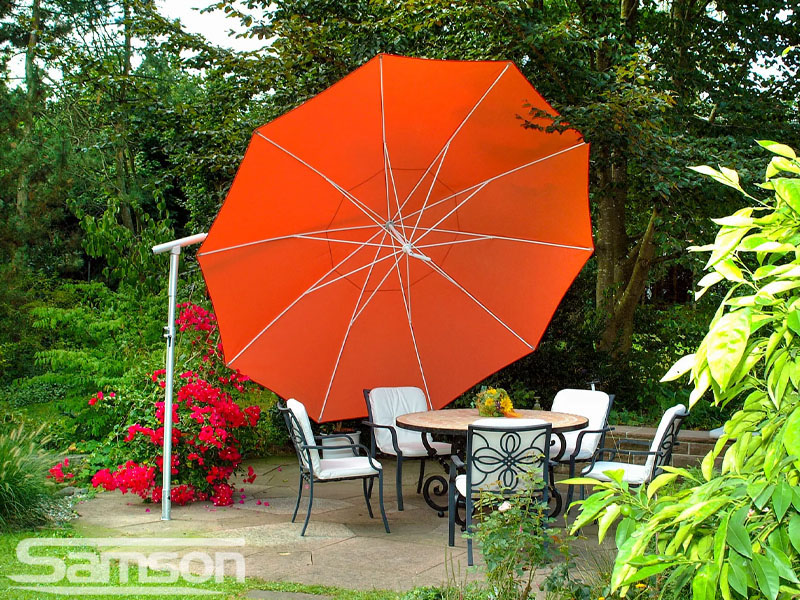 Bright Orange Round Parasol in Domestic Setting